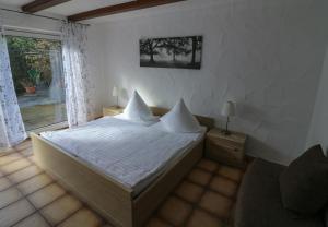 Postel nebo postele na pokoji v ubytování Gästehaus Wildfein