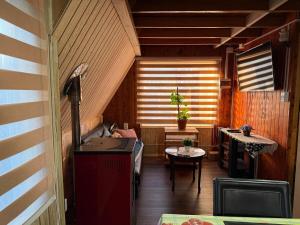 a small room with a couch and a table at Valentine's Day Host Mary Leo Accommodation House in Cochrane