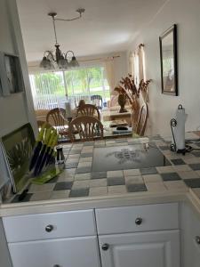 a kitchen with a counter top and a table at casaconejo 2 in Leeward