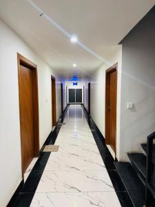 a corridor of an office building with a hallway at Mc Lodge 