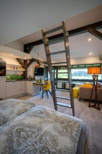 a room with two beds and a kitchen and a living room at Feichten Glück 16 in Siegsdorf