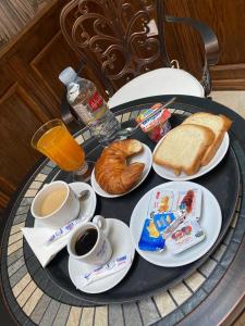 a table with a tray of breakfast food on it at Amirale in Oran