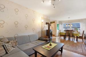 a living room with a couch and a table at Ferienwohnung Königshof in Willingen