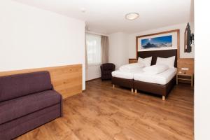 Postel nebo postele na pokoji v ubytování Stöcklhof