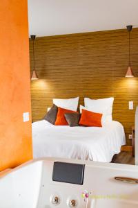 a bedroom with a bed and a bath tub at L'Hostellerie d'Acquigny in Acquigny +177 photos