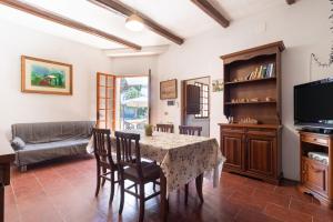 a living room with a table and chairs and a couch at Torre Cappavecchia in Molfetta