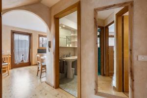 a room with a kitchen with a sink and a mirror at Casa Elisabeth in Cavalese +23 photos