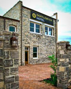 a stone building with a sign that reads dothzerker hotel at Dofflemyer Hotel in San Saba