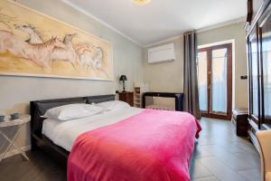 モニーガにあるAppartamento Piccolo Principeのベッドルーム(ベッド1台付)