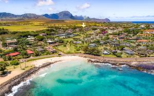 an aerial view of a resort with a beach at 6BR Poipu Kai Oceanfront Retreat Steps to 3 Beaches in Koloa
