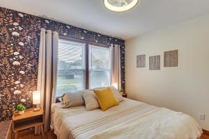 a bedroom with a large bed and a window at 1 Mi to Dtwn Burlington Modern Home with Yard! in Burlington