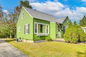 a green house with a gray roof at 1 Mi to Dtwn Burlington Modern Home with Yard! in Burlington