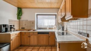 Kuchyň nebo kuchyňský kout v ubytování Ferienhaus Mengelberg