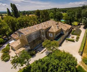 an aerial view of a large house with trees at Voûte in Colonzelle