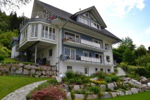 a house with a garden in front of it at Haus Gisela - Stockkamp in Todtmoos
