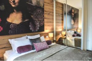 Postel nebo postele na pokoji v ubytování Apartmani Montis Zlatibor + 76 fotografií