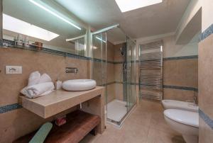 a bathroom with a sink and a shower and a toilet at La Cartapesta in Lecce +18 photos