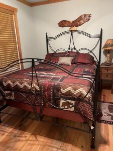 a bedroom with a bed with a bird on top of it at White River Landing in Calico Rock