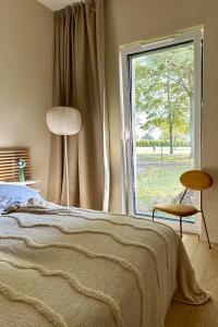 Ένα ή περισσότερα κρεβάτια σε δωμάτιο στο HYGGE Golf House