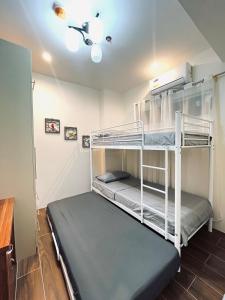 a bedroom with two bunk beds in a room at 2br Unit in Matina Enclaves Davao in Davao City