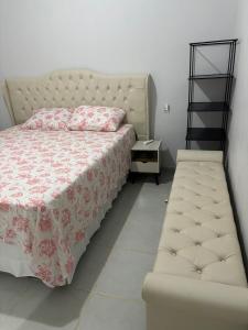 Ένα ή περισσότερα κρεβάτια σε δωμάτιο στο Buriti Home