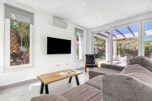 a living room with a couch and a table at Senna in Jávea