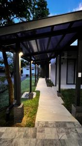 a covered walkway in front of a building at Quebrada Honda GlamShack in Pueblo Nuevo +2 photos