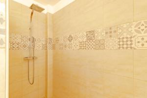 a bathroom with a shower with a glass door at Maison de vacances in Sarlat-la-Canéda +16 photos