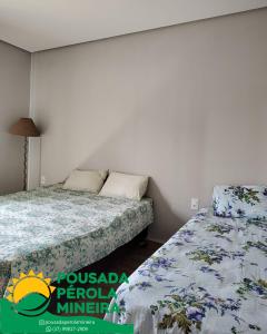 Ένα ή περισσότερα κρεβάτια σε δωμάτιο στο Pousada Pérola Mineira +9 φωτογραφίες