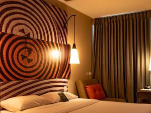 Ένα ή περισσότερα κρεβάτια σε δωμάτιο στο ibis Apartado