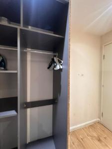 a door with a mirror next to a room at BUDGET Small Rooms in Thamesmead