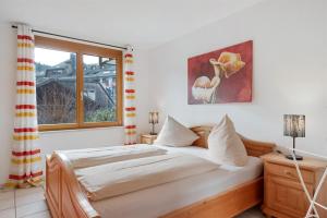 Postel nebo postele na pokoji v ubytování Residenz Am See - Fewo 1 und Fewo 3