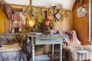 a room with a table with flowers on it at Allgaierarthaus in Bad Waldsee +40 photos