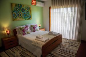 a bedroom with a bed with two towels on it at Recanto Transmontano in Macedo de Cavaleiros +62 photos