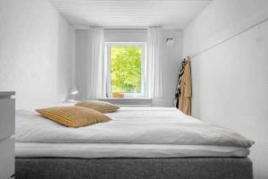 Ένα ή περισσότερα κρεβάτια σε δωμάτιο στο Beautifull 2-Room Apartment With Sea View