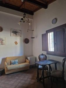 a living room with a couch and a table at Agriturismo la Mandragola Relais in Crotone +37 photos