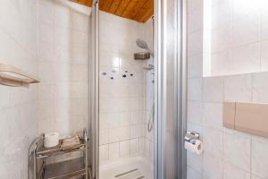 a bathroom with a shower and a toilet at Pension Schüler in Bonndorf im Schwarzwald +35 photos