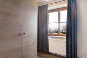 Koupelna v ubytování Angerle Alm Apt König Laurin + 23 fotografií