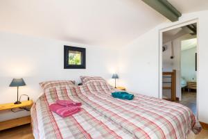 Postel nebo postele na pokoji v ubytování Chalet Piqueyrot