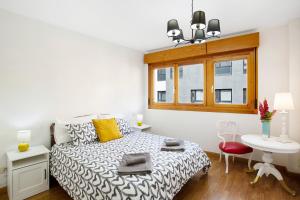 Кровать или кровати в номере Luz Home