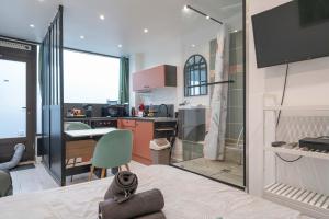 a room with a kitchen and a dining room at L'authentik in Annecy