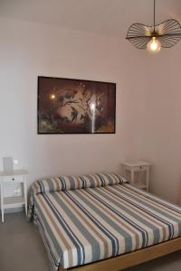 Una cama o camas en una habitación de Appartamento 2m