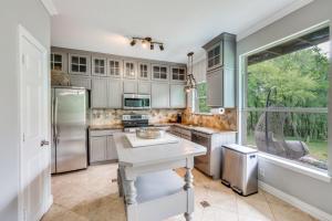 a kitchen with stainless steel appliances and a window at King Bdgame Roomprivate Lake Access in Little Elm