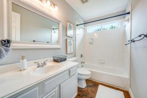 a white bathroom with a sink and a toilet at King Bdgame Roomprivate Lake Access in Little Elm +18 photos