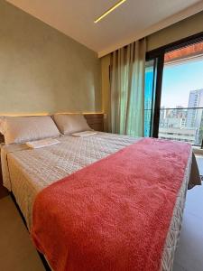 Ένα ή περισσότερα κρεβάτια σε δωμάτιο στο Studio Moderno próximo à Beira-Mar de Fortaleza-Ce