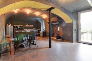 a kitchen and dining room with a table and chairs at Workation Castle in Carlazzo