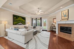 a living room with two couches and a fireplace at Greyhawk Retreat Relaxing 3bd Hideaway in Little Elm