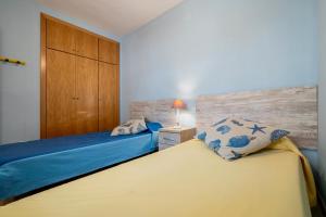 En eller flere senge i et værelse på Costa Linda 313 + 18 billeder