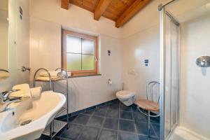 a bathroom with a sink and a toilet at Marschalkhof Ifingerblick in Motini al Rio +15 photos