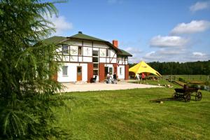 a large building with people standing outside of it at More Guesthouse in More